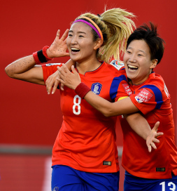 OTTAWA, ON - JUNE 17:  Sohyun Cho of Korea celebrates with Hahnul Kwon of Korea after scoring her teams first goal during the FIFA Women's World Cup 2015 Group E match between Korea Republic and Spain at Lansdowne Stadium on June 17, 2015 in Ottawa, Canada.  (Photo by Lars Baron - FIFA/FIFA via Getty Images)