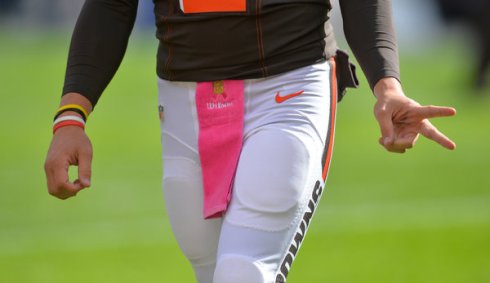 Manziel sporting a pink "Breast Cancer Awareness" towel